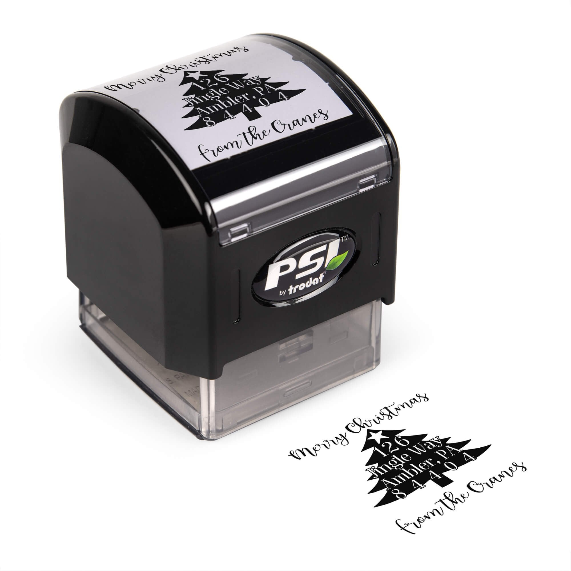 Pre-inked stamp shown from above featuring custom ‘Christmas Tree’  holiday return address design.