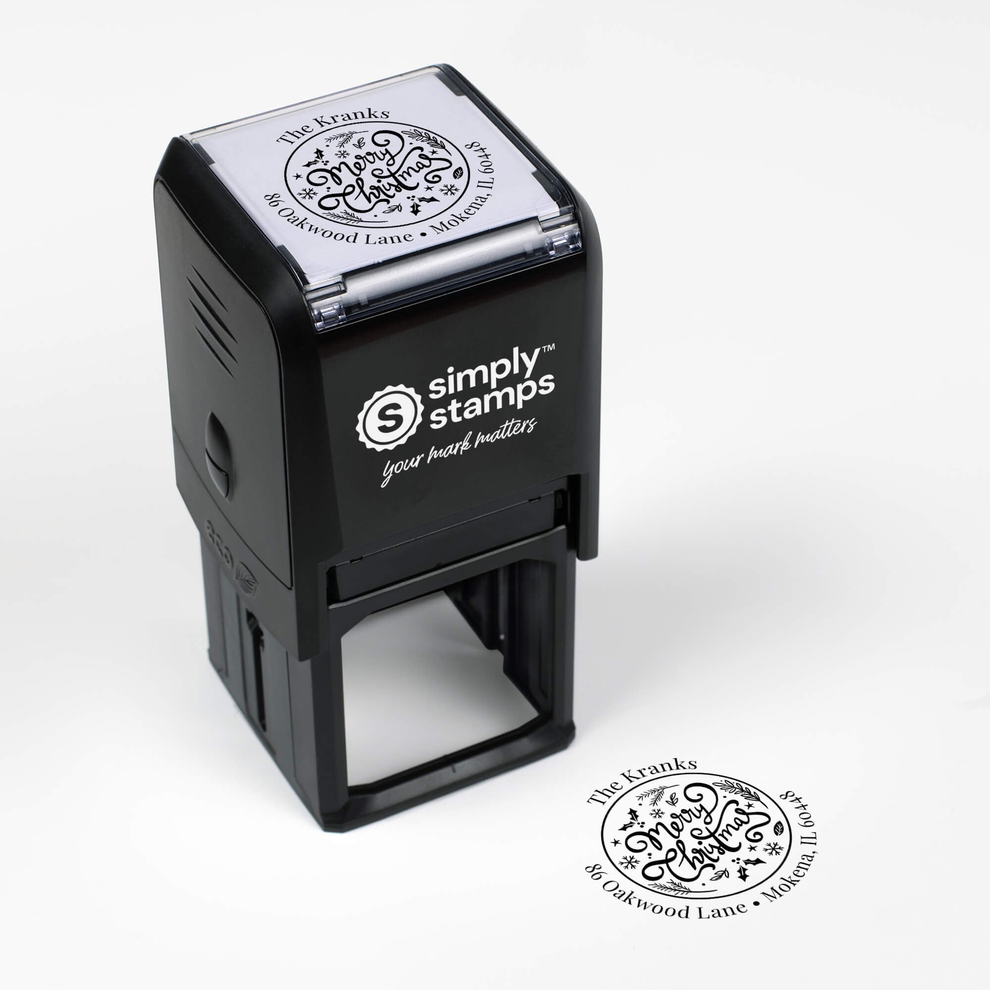 Top angle view of self-inking holiday stamp with circular ‘Merry Christmas Script’ address design.
