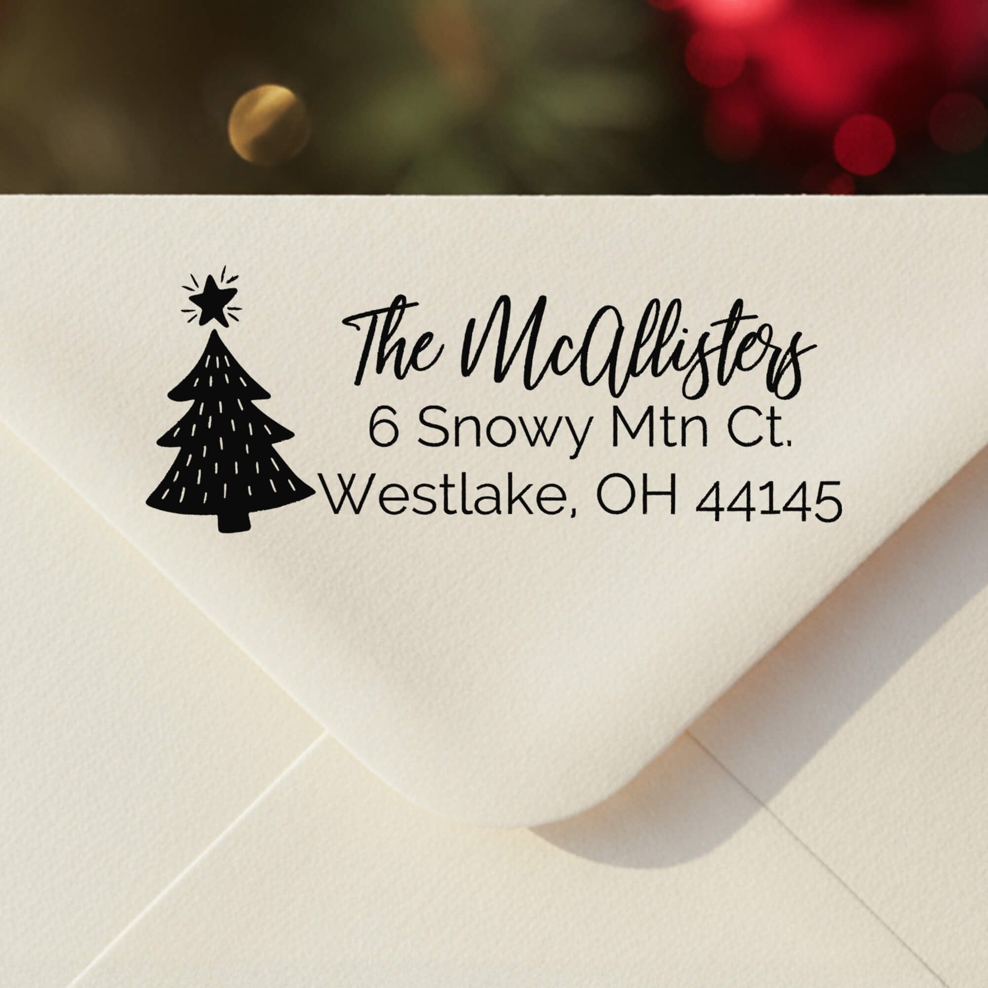 Personalized ‘Christmas Tree Holiday’ address stamp impression on envelope flap for holiday cards.