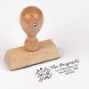 European wood hand stamp shown from above featuring custom ‘Let It Snow Winter Snowman’ holiday return address design.