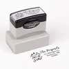 Pre-inked stamp shown from above featuring custom ‘Let It Snow Winter Snowman’  holiday return address design.
