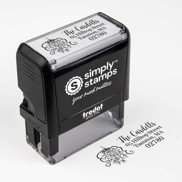 Top angle view of self-inking holiday stamp with ‘Curly Mistletoe Holiday’ address design.