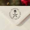 Personalized round ‘Holiday Star’ address stamp impression on envelope flap for holiday cards.
