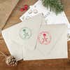 Green and red ink impressions of ‘Holiday Star’ return address stamp on Christmas envelopes.