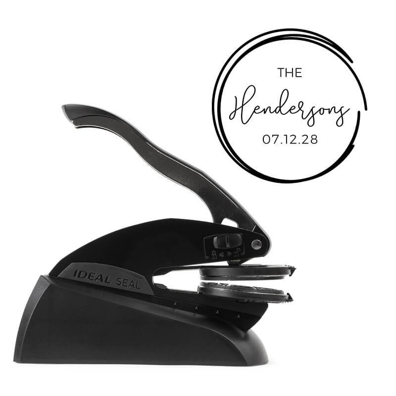 Black embossing tool shown with an impression example 