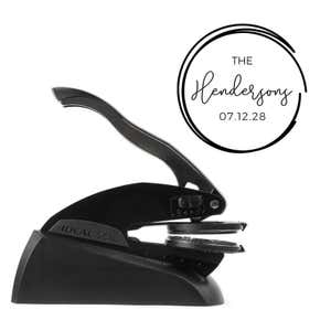 Black embossing tool shown with an impression example 