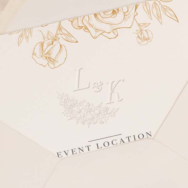 Wedding invitation shown stamped with embossed design