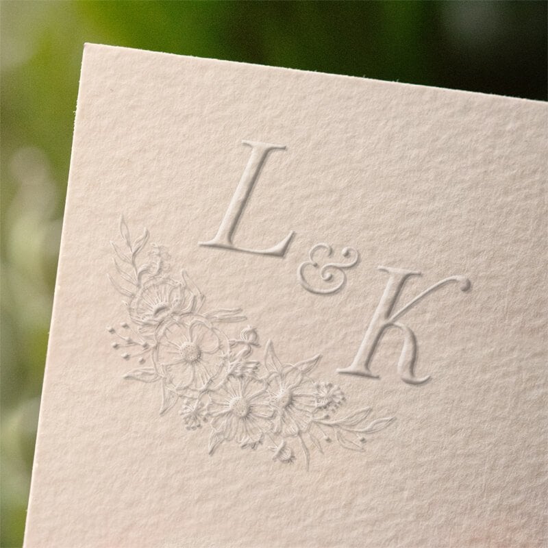 Impression example on paper of a Floral Accent Initials Wedding Embosser