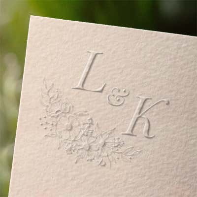 Impression example on paper of a Floral Accent Initials Wedding Embosser