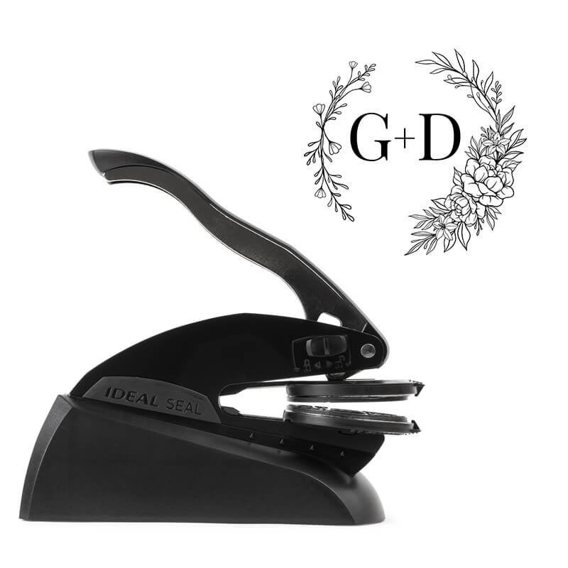 Side view of Ideal Seal custom embosser with sample wedding design shown beside it