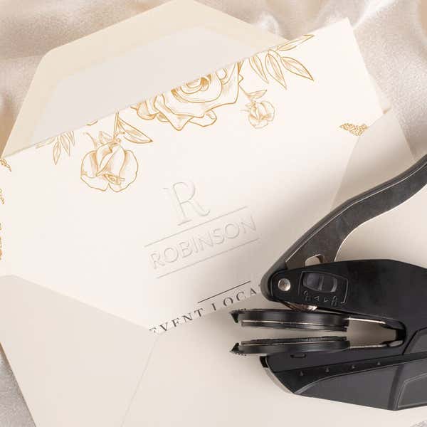 Wedding invitation shown stamped with embossed design