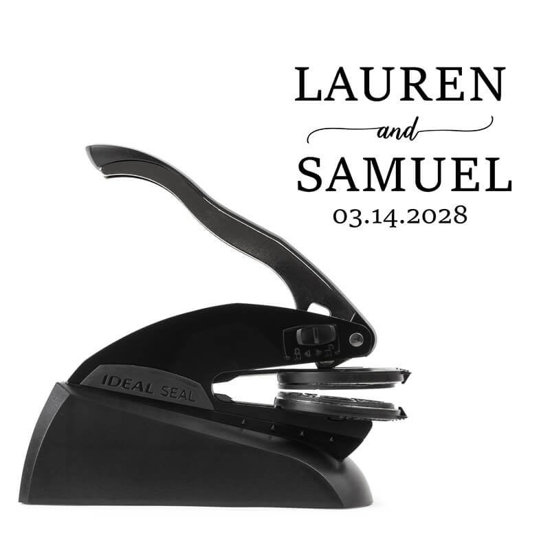 Professional black embosser shown beside a sample impression of the wedding design