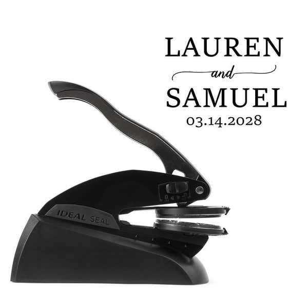 Professional black embosser shown beside a sample impression of the wedding design
