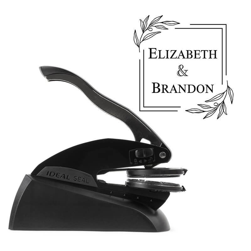 Professional black embosser shown beside a sample impression of the wedding design