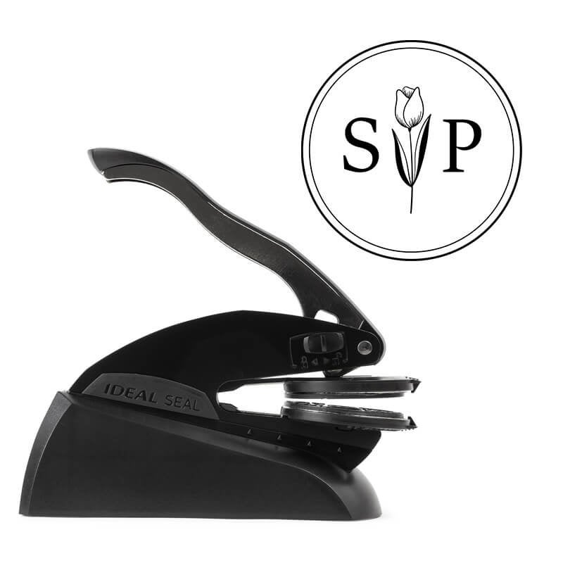 Side view of Ideal Seal custom embosser with sample wedding design shown beside it