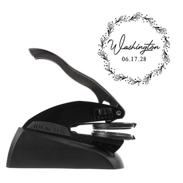 Professional black embosser shown beside a sample impression print