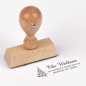 European wood hand stamp shown from above featuring custom ‘Walton Christmas Tree’ holiday return address design.