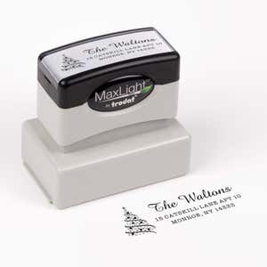 Pre-inked stamp shown from above featuring custom ‘Walton Christmas Tree’  holiday return address design.
