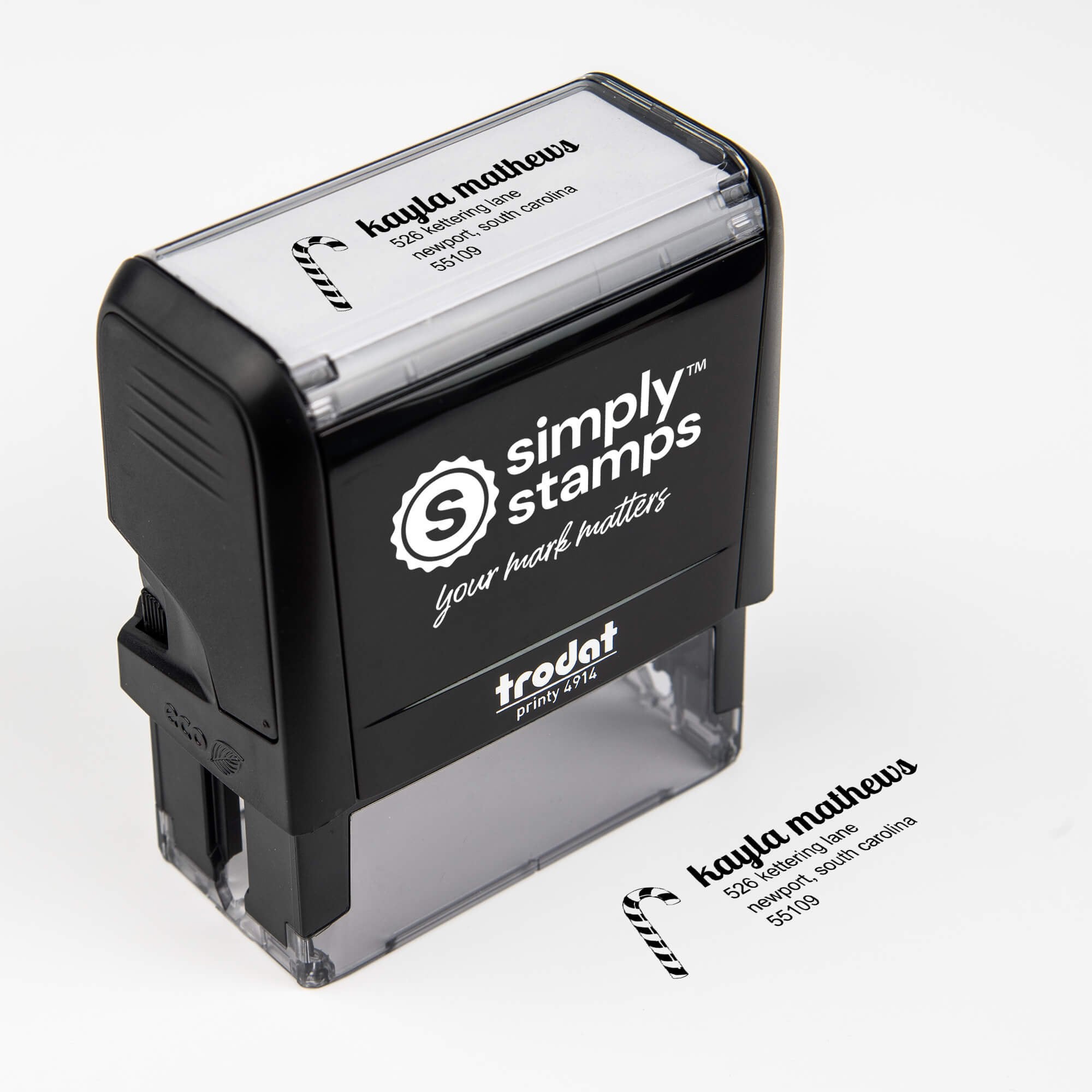 Top angle view of self-inking holiday stamp with ‘Mathews Candy Cane’ address design.