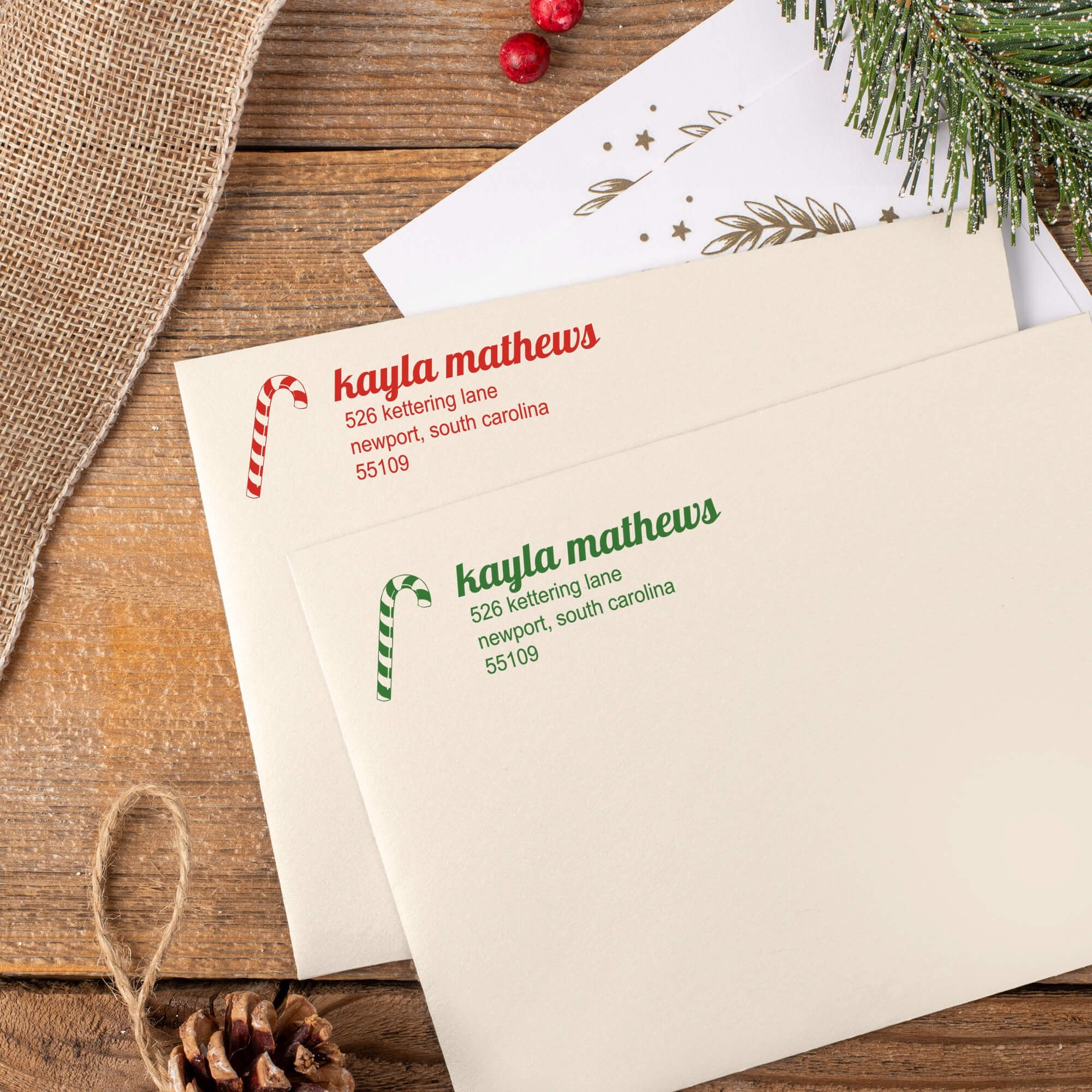 Green and red ink impressions of ‘Mathews Candy Cane’ return address stamp on Christmas envelopes.