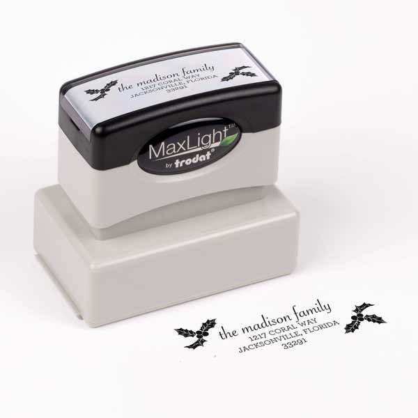 Pre-inked stamp shown from above featuring custom ‘Madison Holly’  holiday return address design.