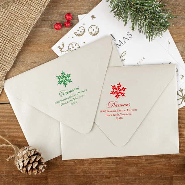 Green and red ink impressions of ‘Danvers Snowflake’ return address stamp on Christmas envelopes.