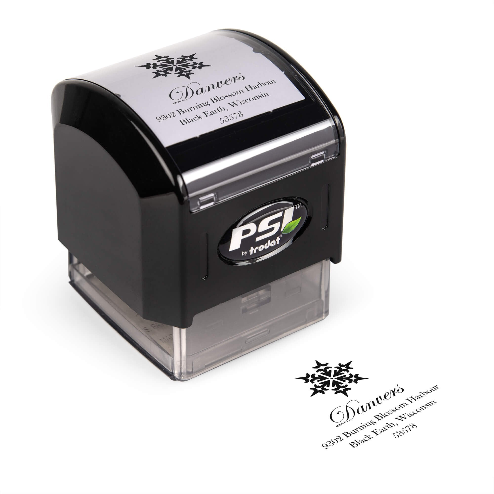 Pre-inked stamp shown from above featuring custom ‘Danvers Snowflake’ holiday return address design.