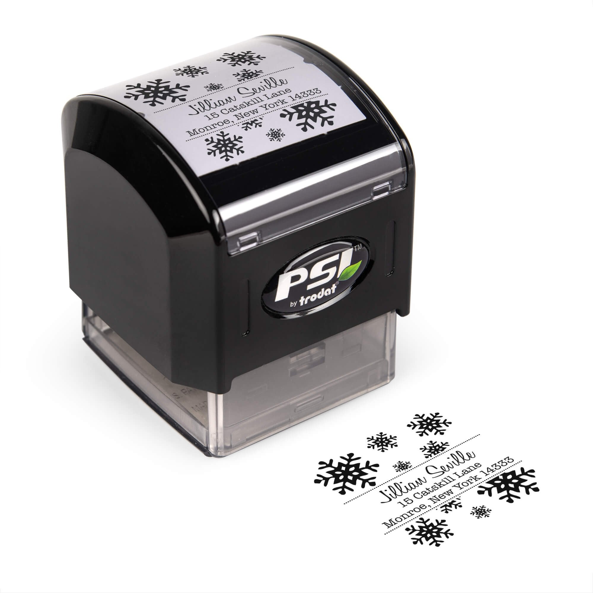 Pre-inked stamp shown from above featuring custom ‘Seville Snowflakes’  holiday return address design.