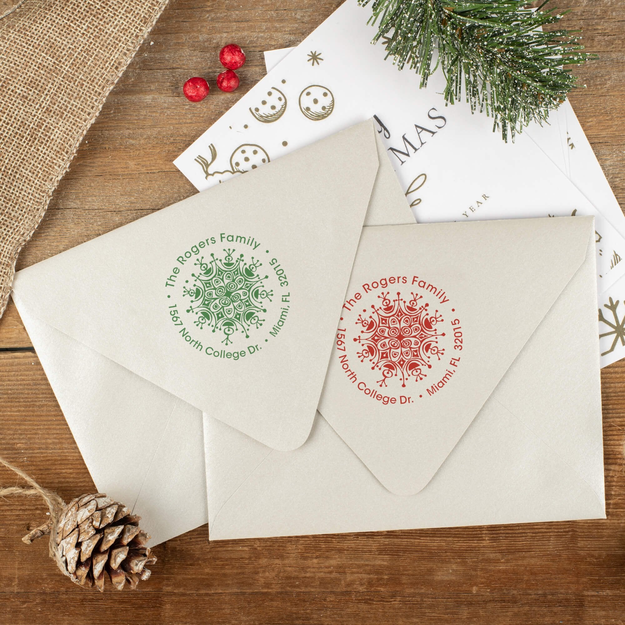 Green and red ink impressions of ‘Rogers Ornament Round’ return address stamp on Christmas envelopes.