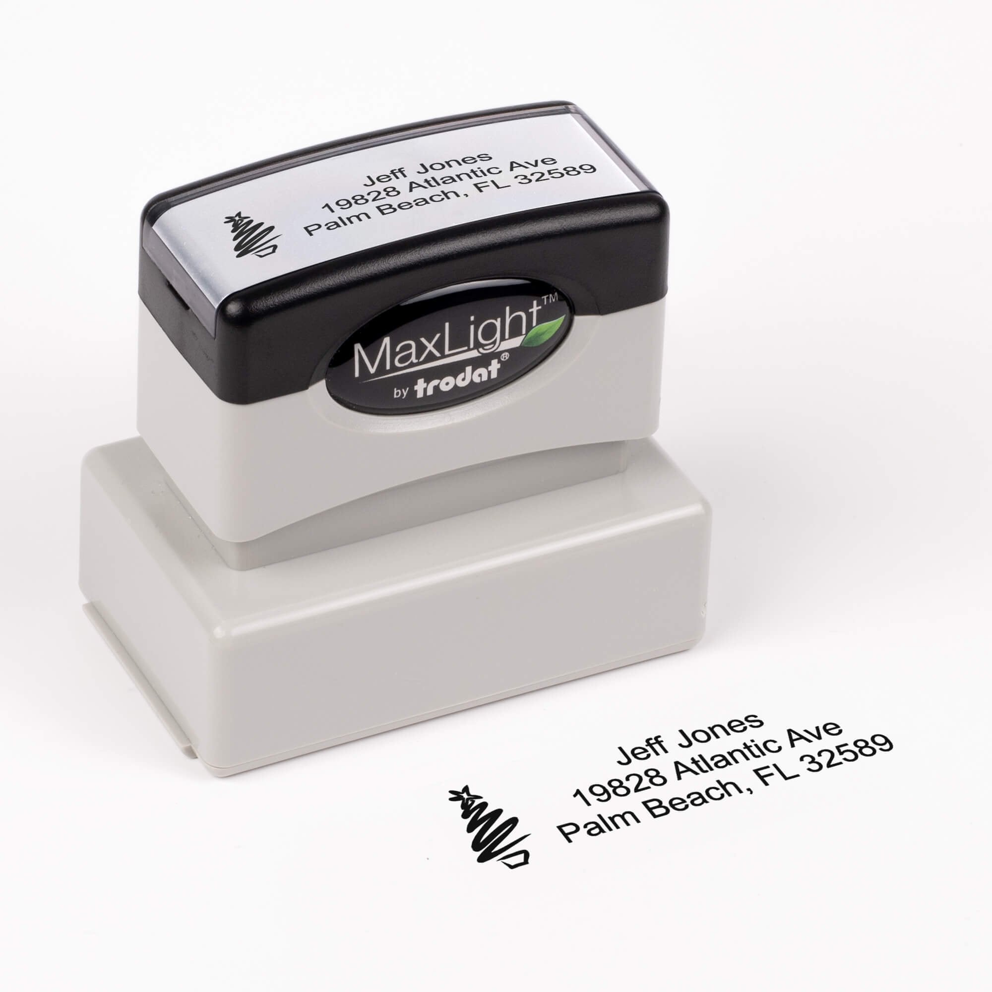 Pre-inked stamp shown from above featuring custom ‘Holiday Custom Icon’  holiday return address design.