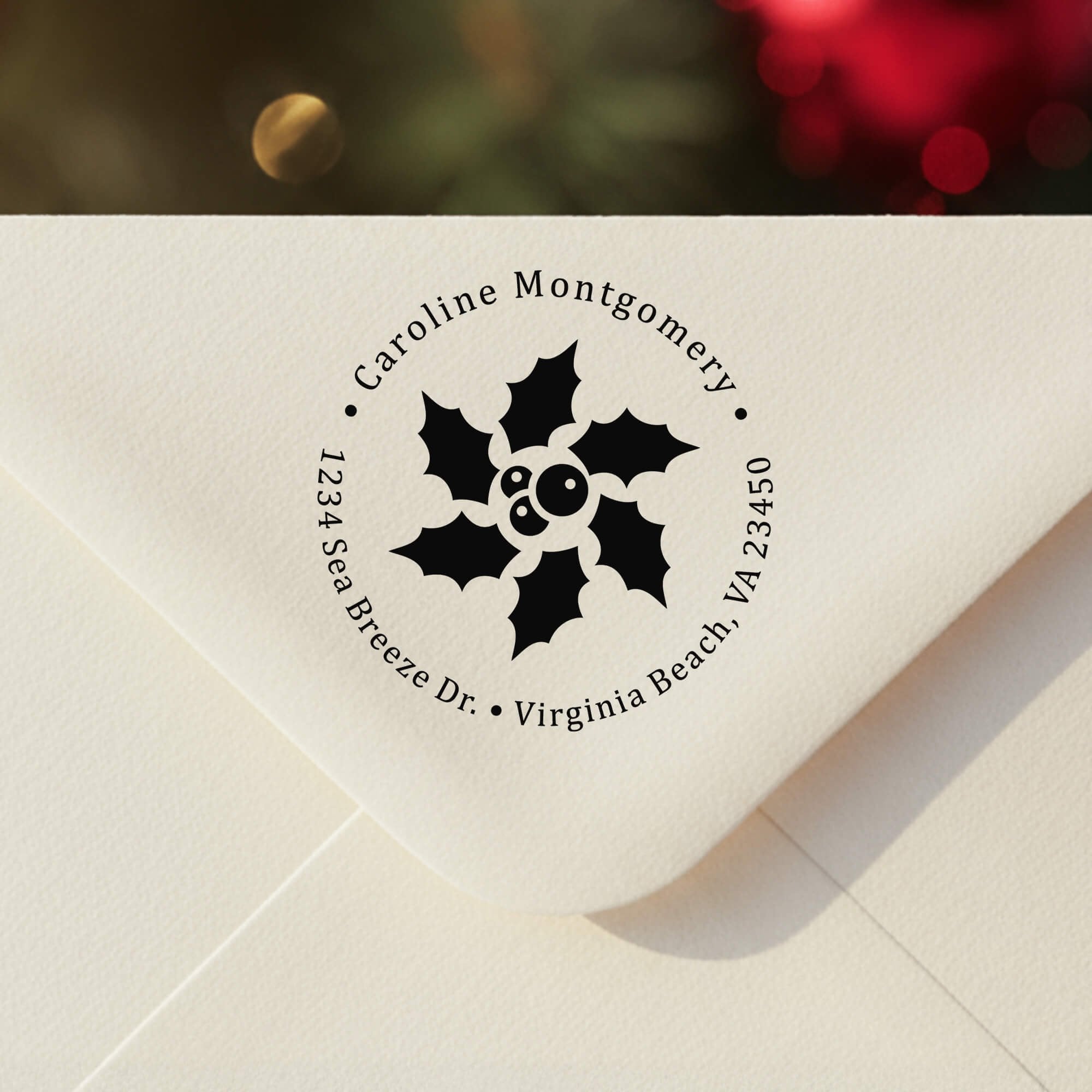 Personalized ‘Star Holly’ address stamp impression on envelope flap for holiday cards.