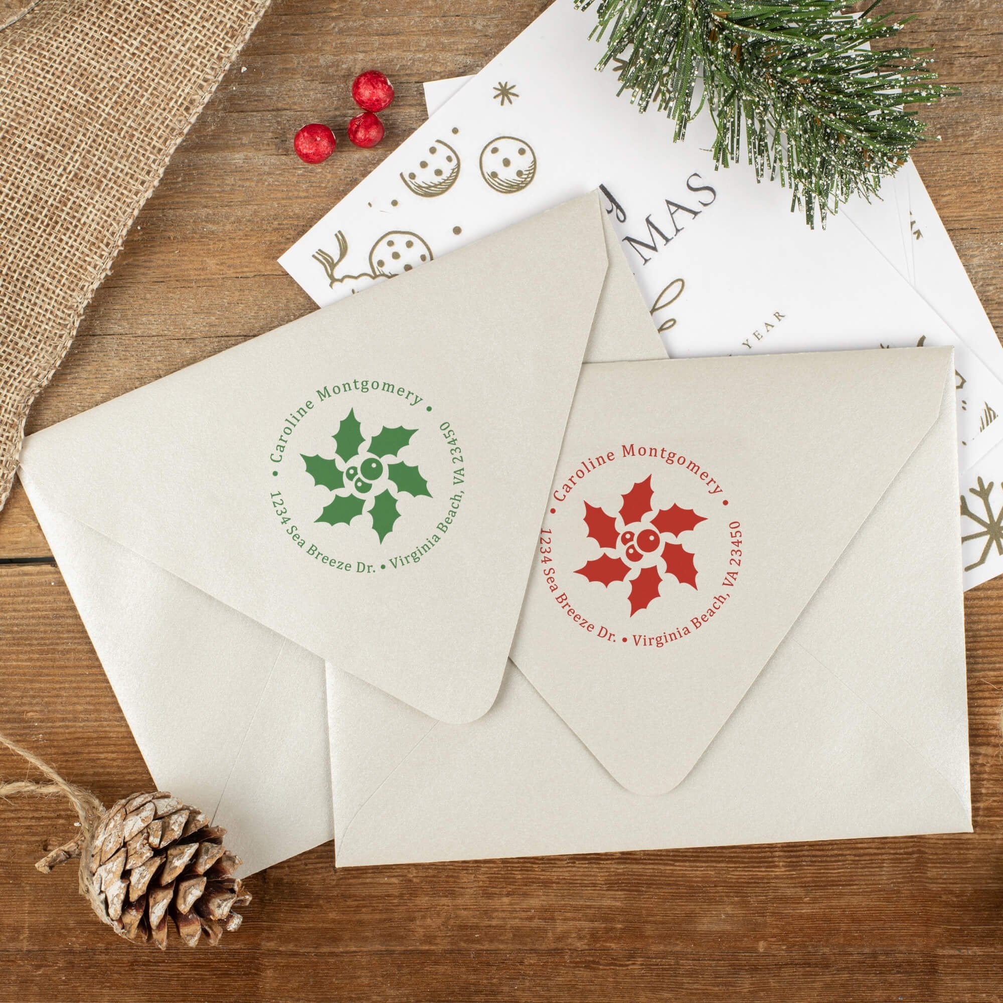 Green and red ink impressions of ‘Star Holly’ return address stamp on Christmas envelopes.