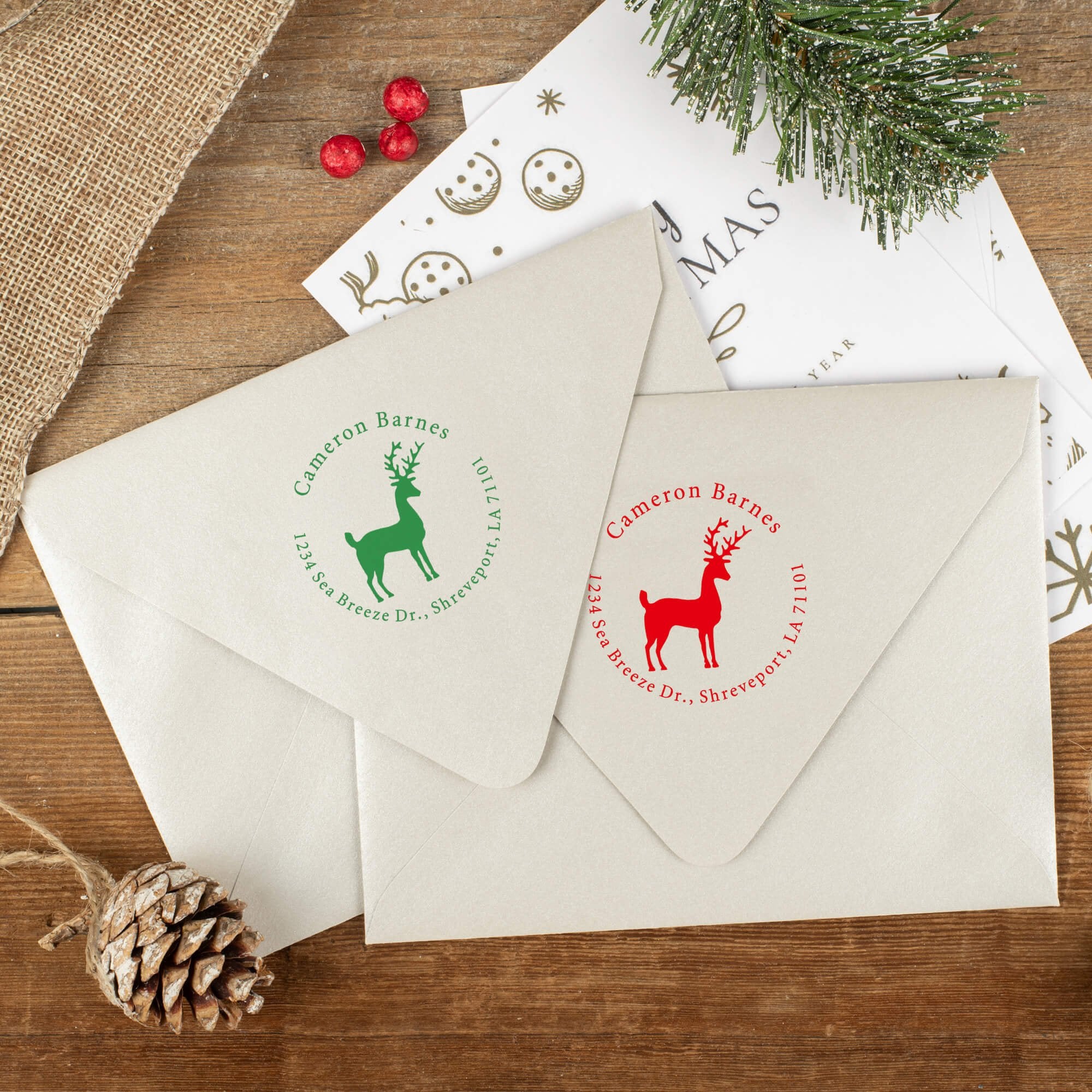 Green and red ink impressions of ‘Stag Reindeer’ return address stamp on Christmas envelopes.