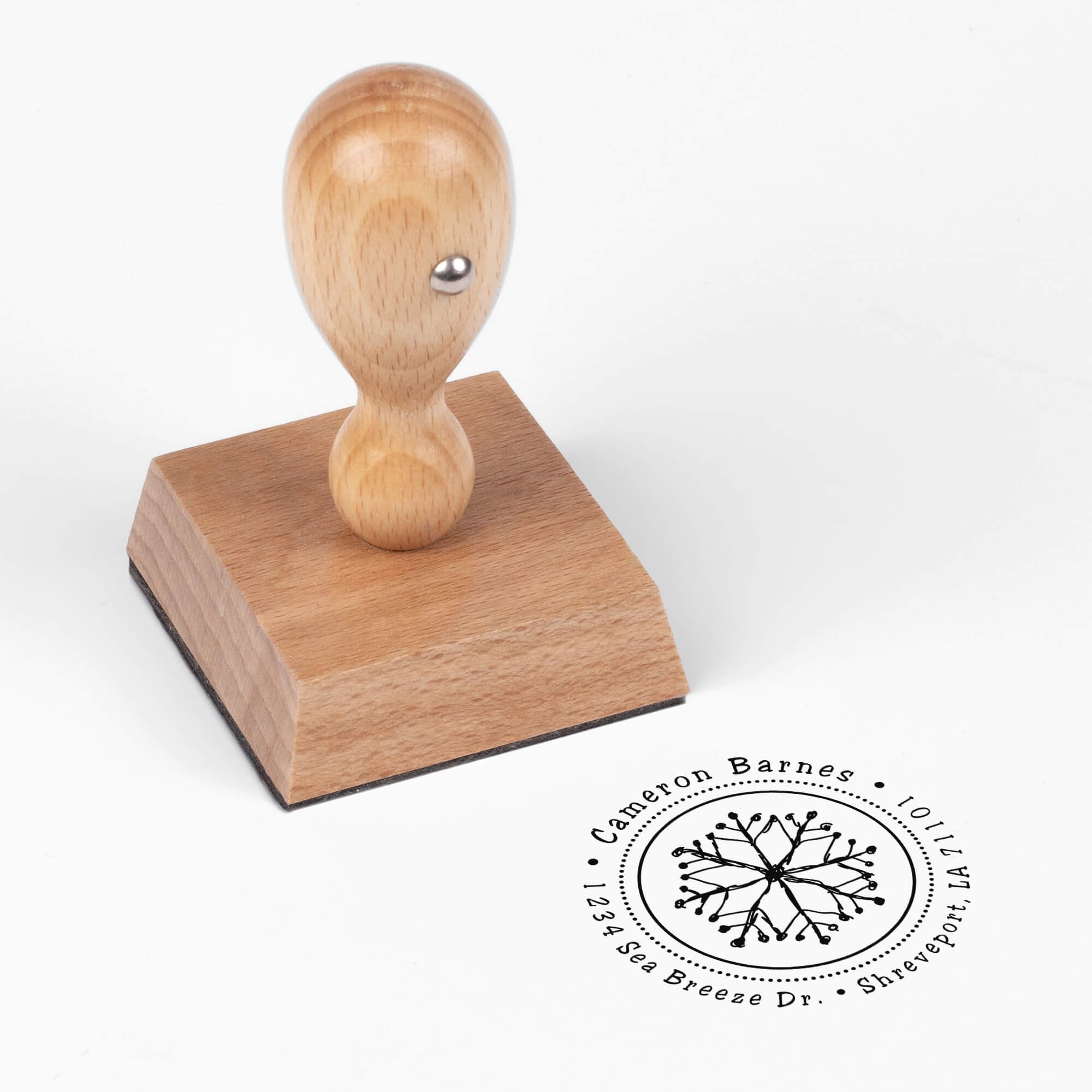 European wood hand stamp shown from above featuring custom ‘Hand Drawn Snowflake’ holiday return address design.