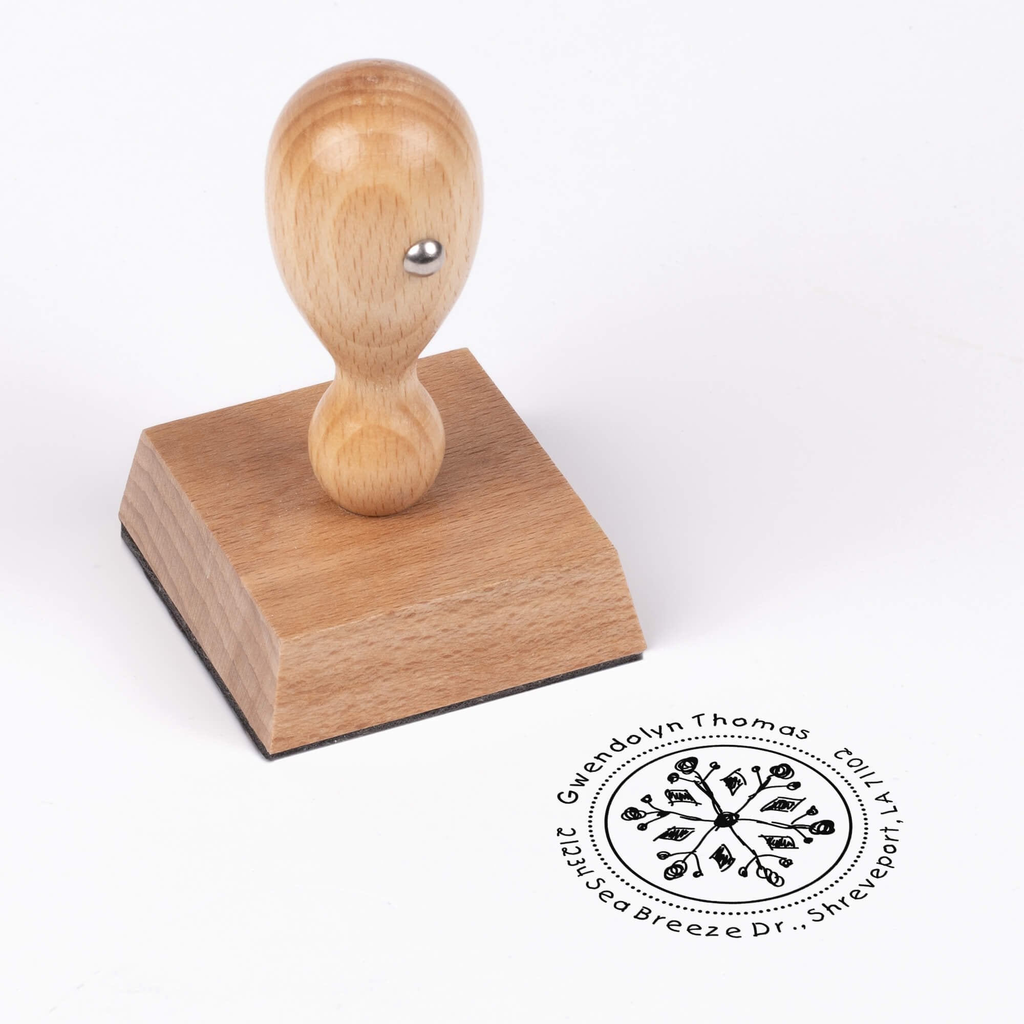 European wood hand stamp shown from above featuring custom ‘Hand Drawn Snowflake’ holiday return address design.