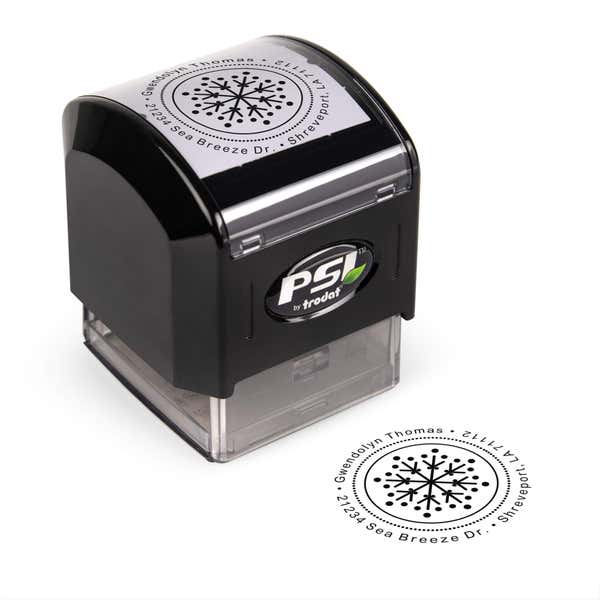 Pre-inked stamp shown from above featuring custom ‘Dotted Snowflake’  holiday return address design.