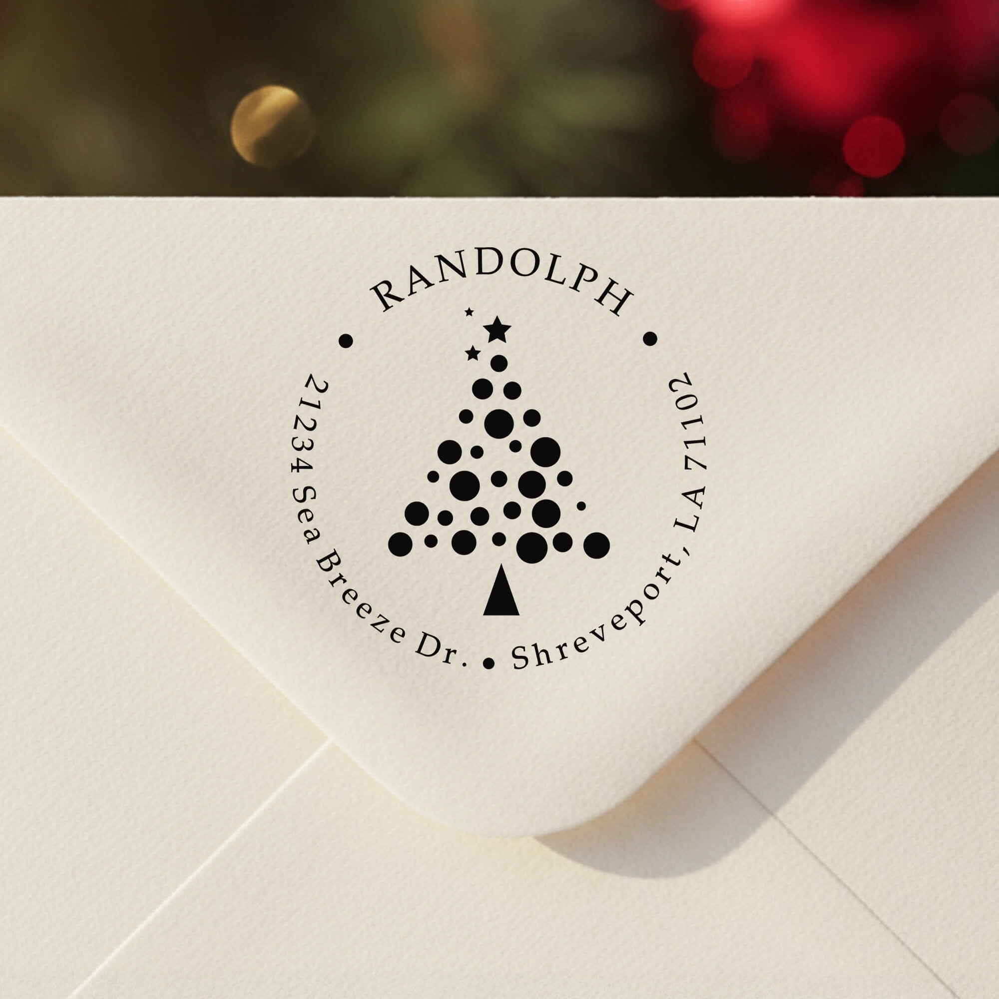 Personalized ‘Polka Dot Christmas Tree’ address stamp impression on envelope flap for holiday cards.