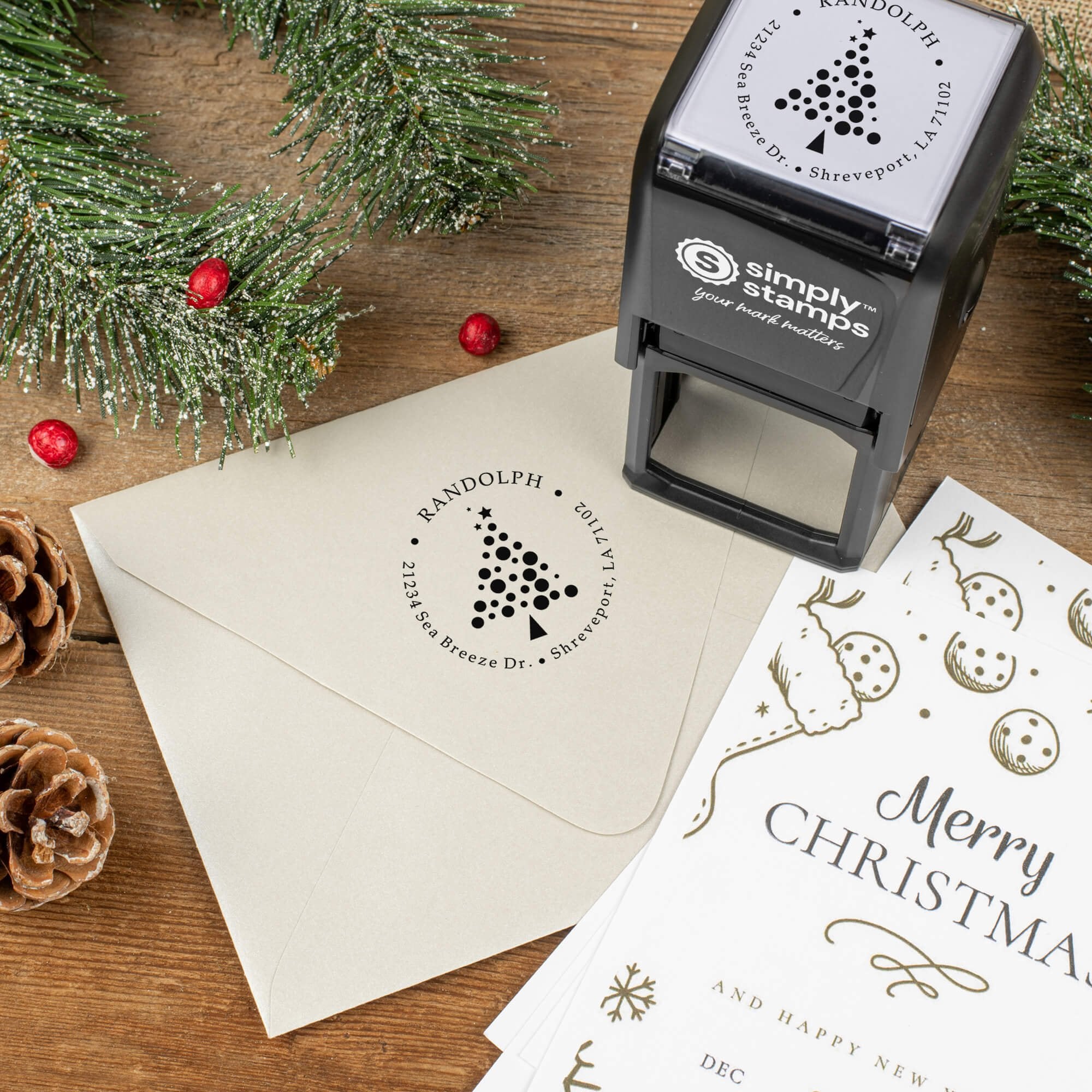 Holiday-themed ‘Polka Dot Christmas Tree’ address stamp shown on envelopes beside festive stationery, pinecones, and decorations.