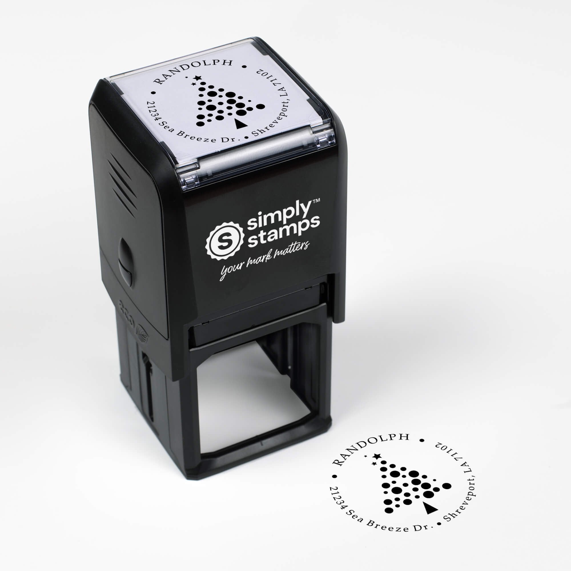 Top angle view of self-inking holiday stamp with circular ‘Polka Dot Christmas Tree’ address design.