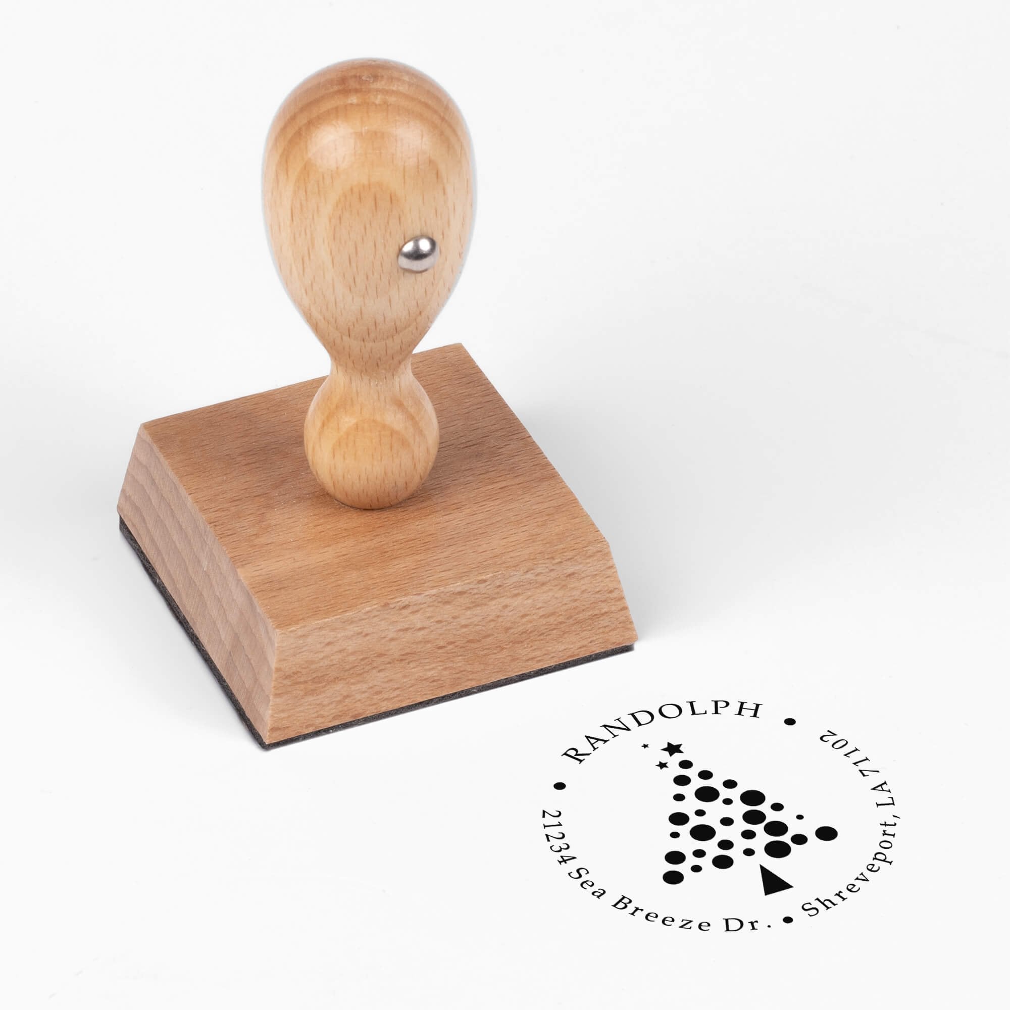 European wood hand stamp shown from above featuring custom ‘Polka Dot Christmas Tree’ holiday return address design.
