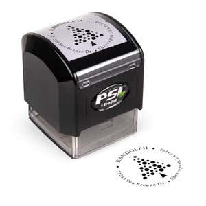 Pre-inked stamp shown from above featuring custom ‘Polka Dot Christmas Tree’  holiday return address design.