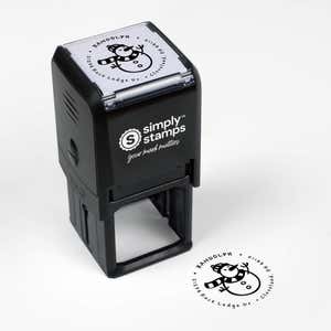 Top angle view of self-inking holiday stamp with circular ‘Scarved Snowman’ address design.