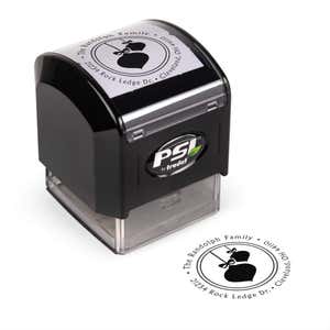 Pre-inked stamp shown from above featuring custom ‘Randolph Christmas Ornaments’  holiday return address design.