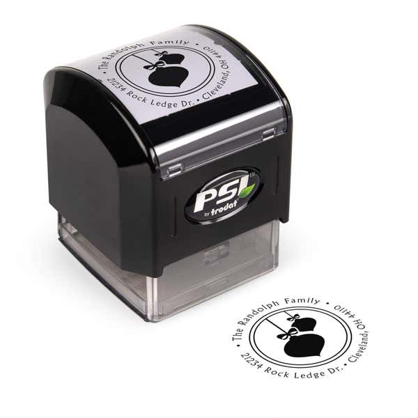 Pre-inked stamp shown from above featuring custom ‘Randolph Christmas Ornaments’  holiday return address design.