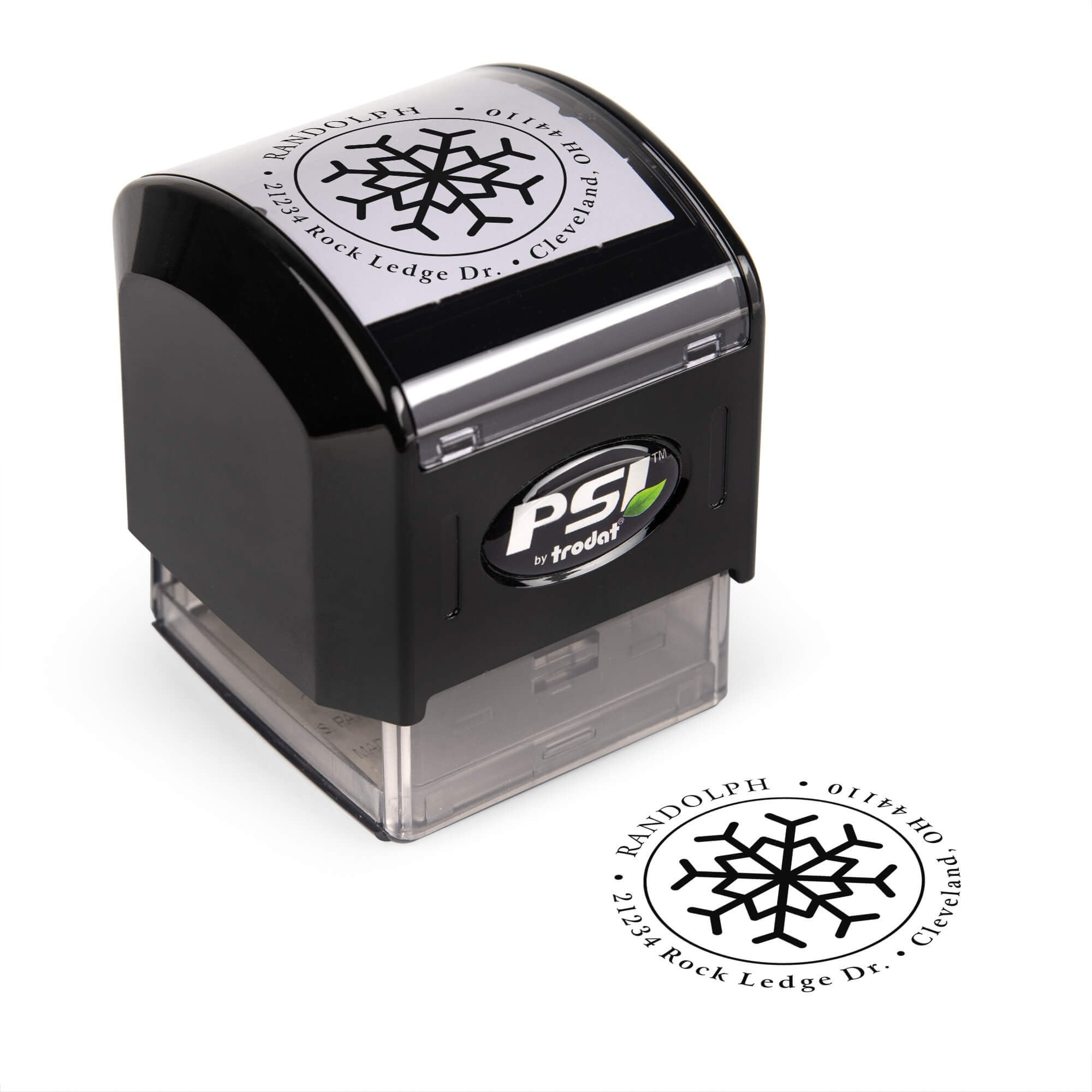 Pre-inked stamp shown from above featuring custom ‘Eight Point Snowflake’  holiday return address design.