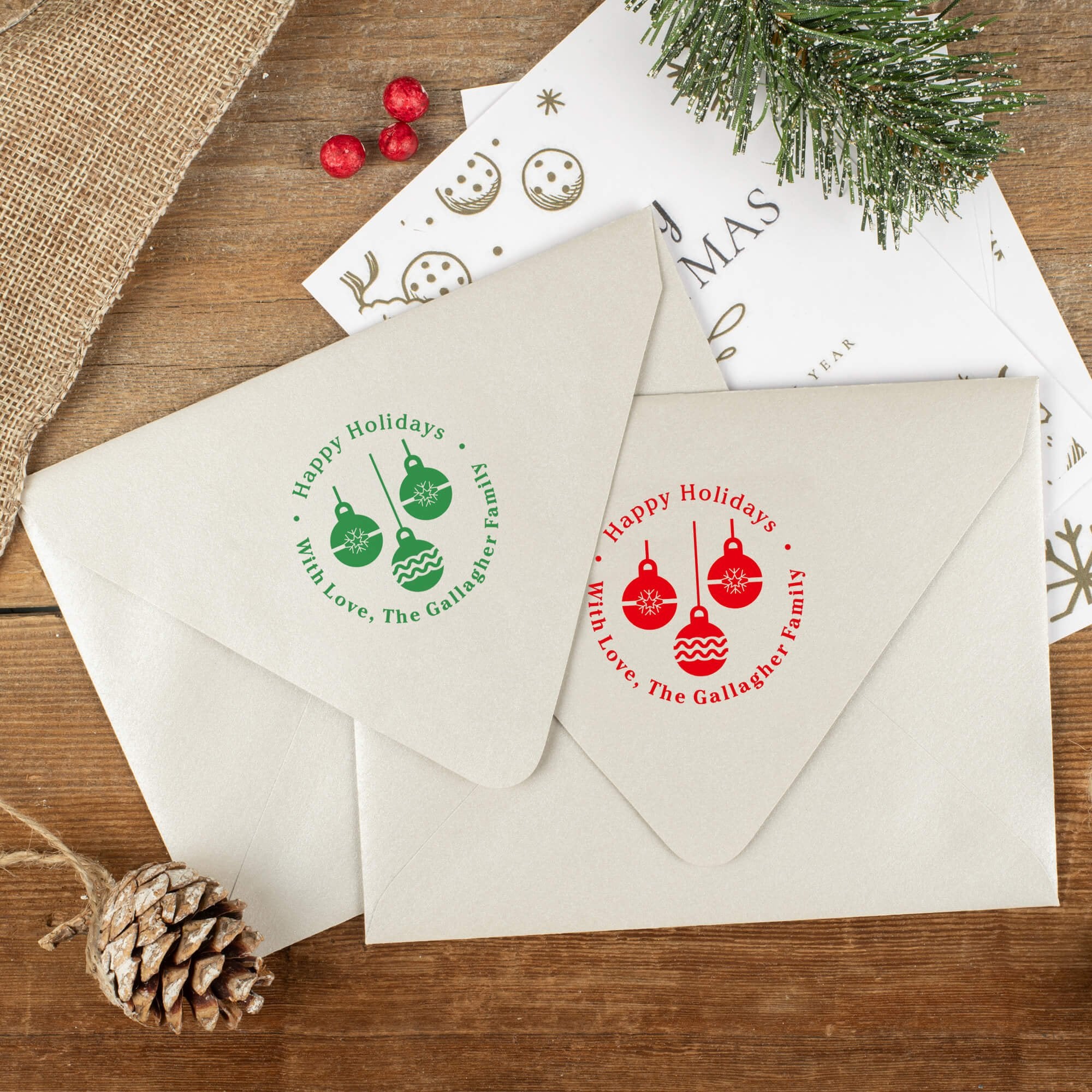 Green and red ink impressions of ‘Three Christmas Ornaments’ return address stamp on Christmas envelopes.