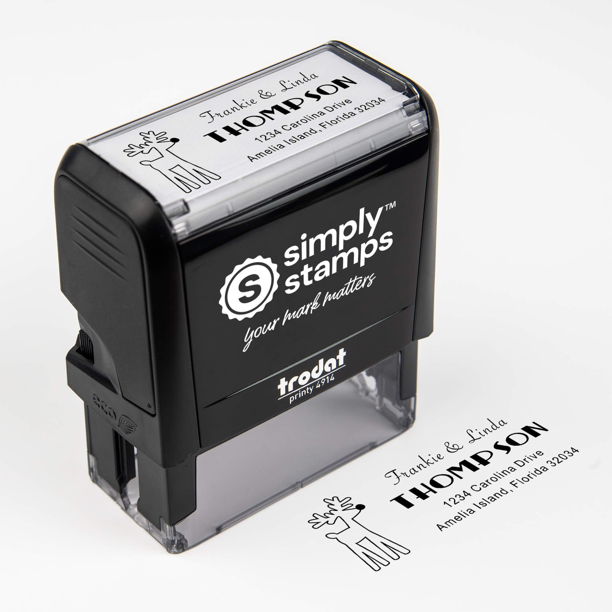 Top angle view of self-inking holiday stamp with circular ‘Rudolph Reindeer’ address design.