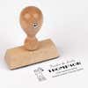 European wood hand stamp shown from above featuring custom ‘Rudolph Reindeer’ holiday return address design.