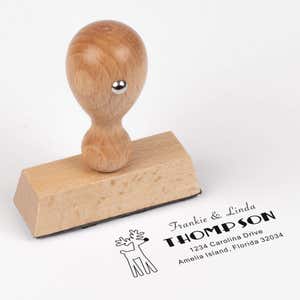 European wood hand stamp shown from above featuring custom ‘Rudolph Reindeer’ holiday return address design.