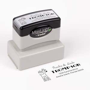 Pre-inked stamp shown from above featuring custom ‘Rudolph Reindeer’  holiday return address design.